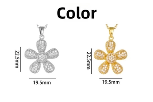 Macro shot of silver and gold flower pendants with zircon pavé measuring 22.5mm by 19.5mm