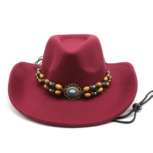 Detail of burgundy wool western cowboy hat featuring multi-layer beaded ethnic hatband