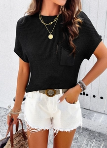 Detail showing soft black short sleeve knit top with crew neck and small chest pocket