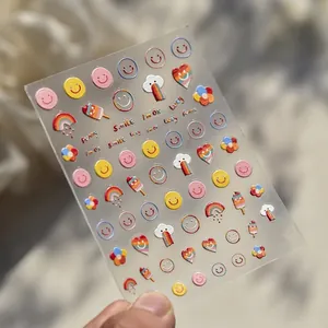 Detail of 3D embossed nail art stickers with rainbow and colorful smile faces