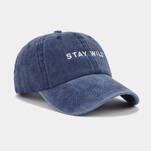 Detail of Stay Wild embroidery on navy blue washed cotton vintage baseball cap