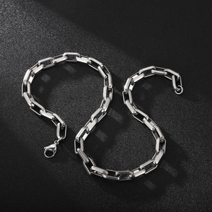 Close-up of silver-tone titanium steel square box chain for men with a metallic texture