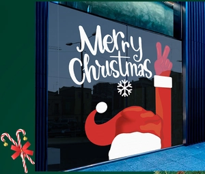 Detail of red and white Santa Claus window static stickers with Merry Christmas text on glass