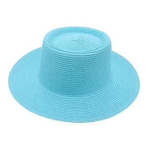 Sky blue woven flat top straw hat with a modern wide brim for summer outdoor sun protection