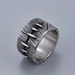 Retro punk style wide ring with industrial stitch texture and vintage silver finish