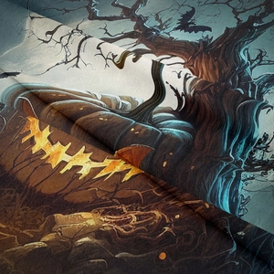 Close-up detail of Halloween tapestry fabric showing pumpkin, bat prints and fiber texture