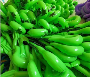 Pile of green inflatable PVC guitars with Rock print for party and stage prop