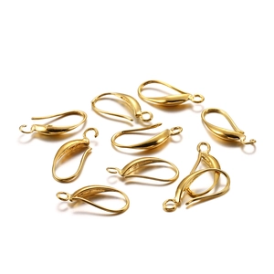 Macro shot of polished gold copper water drop earring hooks for DIY jewelry crafting