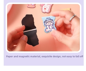 Close-up of cute cartoon magnetic bookmark featuring milk character and pink rabbit design