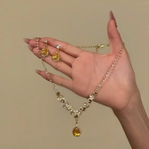 Elegant gold jewelry set with yellow teardrop zircon pendant necklace and earrings