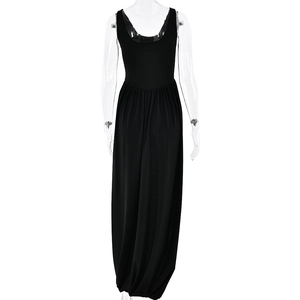 Close-up of the elegant open back design on a sleek black sleeveless maxi dress