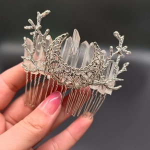 Detail of silver branch and moon hair comb with raw clear crystal quartz stones