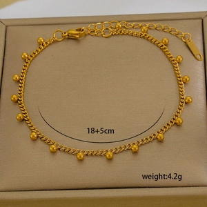 Detailed macro view of 18K gold plated beaded bracelet with 18+5cm size specs