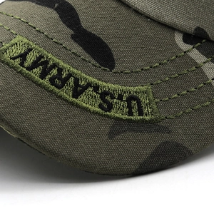 Close-up of U.S. ARMY embroidery on green camouflage tactical baseball cap brim