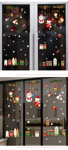 Detailed Christmas window stickers with Santa, reindeer and snowman in home kitchen setting