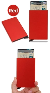Detail of red RFID-blocking aluminum card holder with automatic pop-up slide mechanism