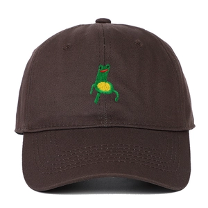 Detail of green frog embroidery on dark brown cotton twill baseball cap with clean stitching