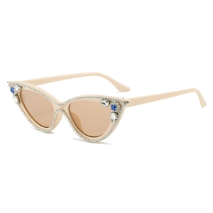 Fashionable cat eye sunglasses in beige with sparkling diamond chain accents on frames