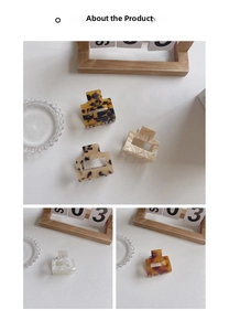 Macro detail of hollow square acetate hair claw clips in tortoiseshell and marble patterns