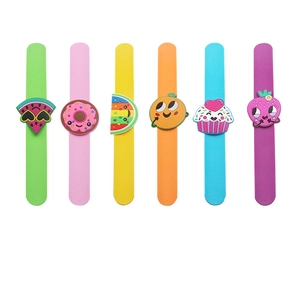 Colorful silicone slap bracelets with cartoon fruit, rainbow, and cupcake charms for kids