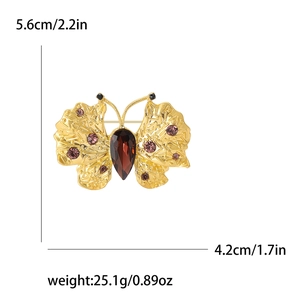 Golden butterfly brooch with red gemstone, size 5.6cm by 4.2cm, weight 25.1g