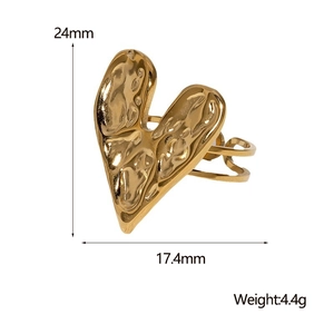 Detailed view of golden heart ring with dimensions 24mm height and irregular lava design