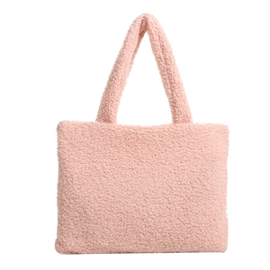 Chic pink plush tote bag for women featuring a fuzzy faux fur finish and dual handles