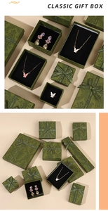 Classic dark green jewelry gift box featuring elegant European patterns and satin ribbons