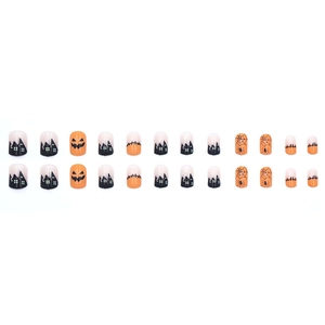 Set unghie finte Halloween corte con motivi a zucca e castello nero su fondo arancio