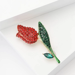 Elegant tulip flower brooch with red rhinestones and green enamel on a gold metal base