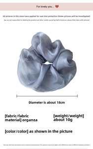 Macro detail of oversized organza hair scrunchie with 18cm diameter and shimmer finish