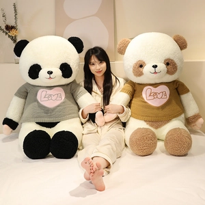 Giant panda plush toy wearing heart knit sweater in black and brown color options