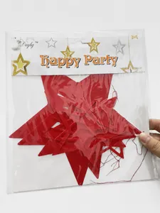 Close-up of red hollow star ceiling decorations for festive wedding and party events