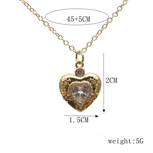 Detailed view of gold heart devil eye necklace with 45+5cm chain size measurements