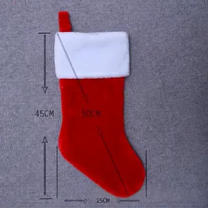 Detail view of a red plush Christmas stocking with size measurements and hanging strap