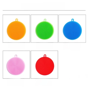 Detail view of colorful silicone dish brushes with hanging holes and dense cleaning bristles