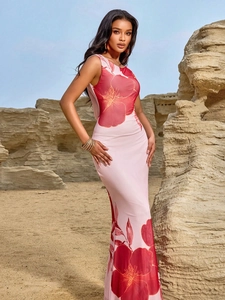 Elegant floral print sleeveless maxi dress with a halter neck and pink A-line silhouette
