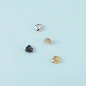 Polished stainless steel heart-shaped pendants in silver, gold, rose gold, and black colors