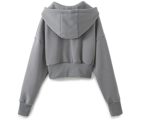 Detail of grey cropped hoodie with ribbed cuffs and drop shoulder seam on white background