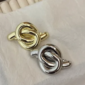 Minimalist geometric alloy hair clips in gold and silver finish with elegant knot design