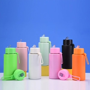 Macro shot of colorful matte stainless steel tumblers with hidden straws and silicone rings