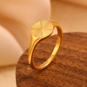 Minimalist 18K gold plated stainless steel sunburst signet ring with radial relief texture