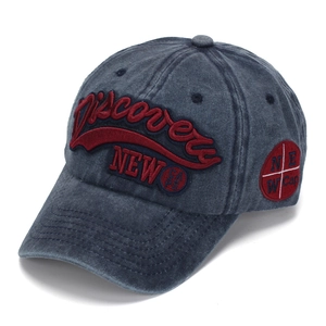 Detailed close-up of 3D Discovery embroidery on vintage washed navy baseball cap