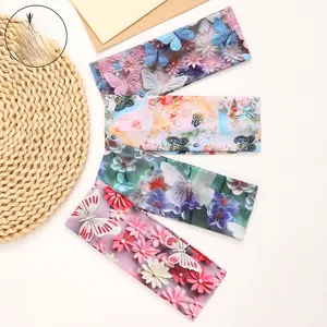 Detail of wide bohemian headbands with colorful butterfly and floral 3D prints