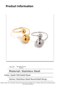Detailed macro view of 18K gold plated and steel spheres on minimalist open rings