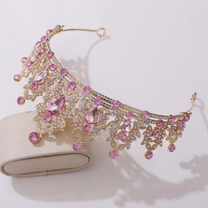 Detailed macro view of leaf design bridal crown with pink crystals and rhinestones