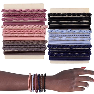 Detail of bohemian handmade elastic hair ties in various colors on display cards