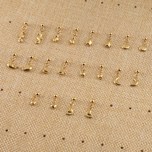 10 paires de boucles d'oreilles dorées en acier inoxydable thème océan sur toile