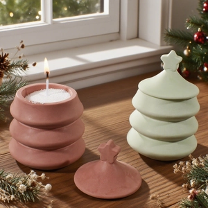 Christmas tree candle jars in pink and green with star lids for festive home decor