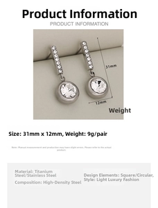 Detail view of crystal-encrusted stainless steel drop earrings with circular main stones